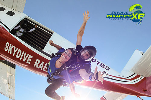 girl tandem skydiving near Raleigh