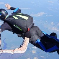 instructor guides learn to skydive student through exit and freefall