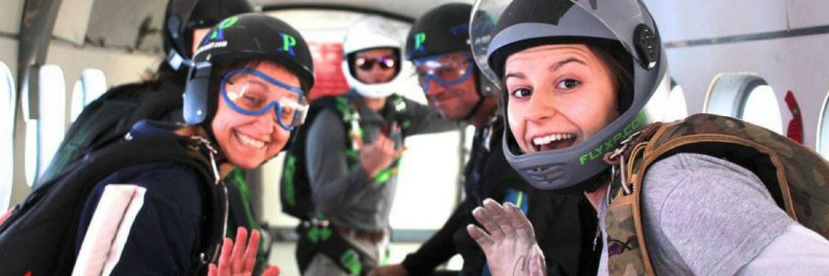 inside of a skydiving plane full of jumpers