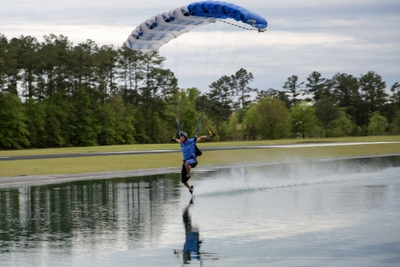 skydiver lands into swoop pond