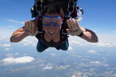 first time skydiver with writing on her hands