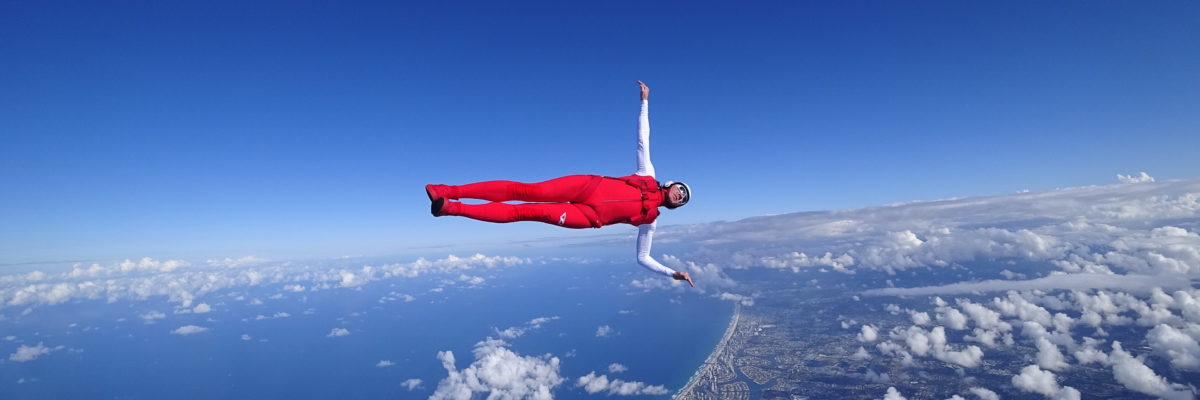 Skydiver side flying in freefall